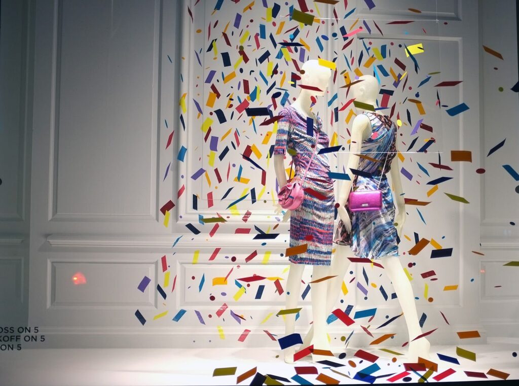 Clothes window display on confetti background