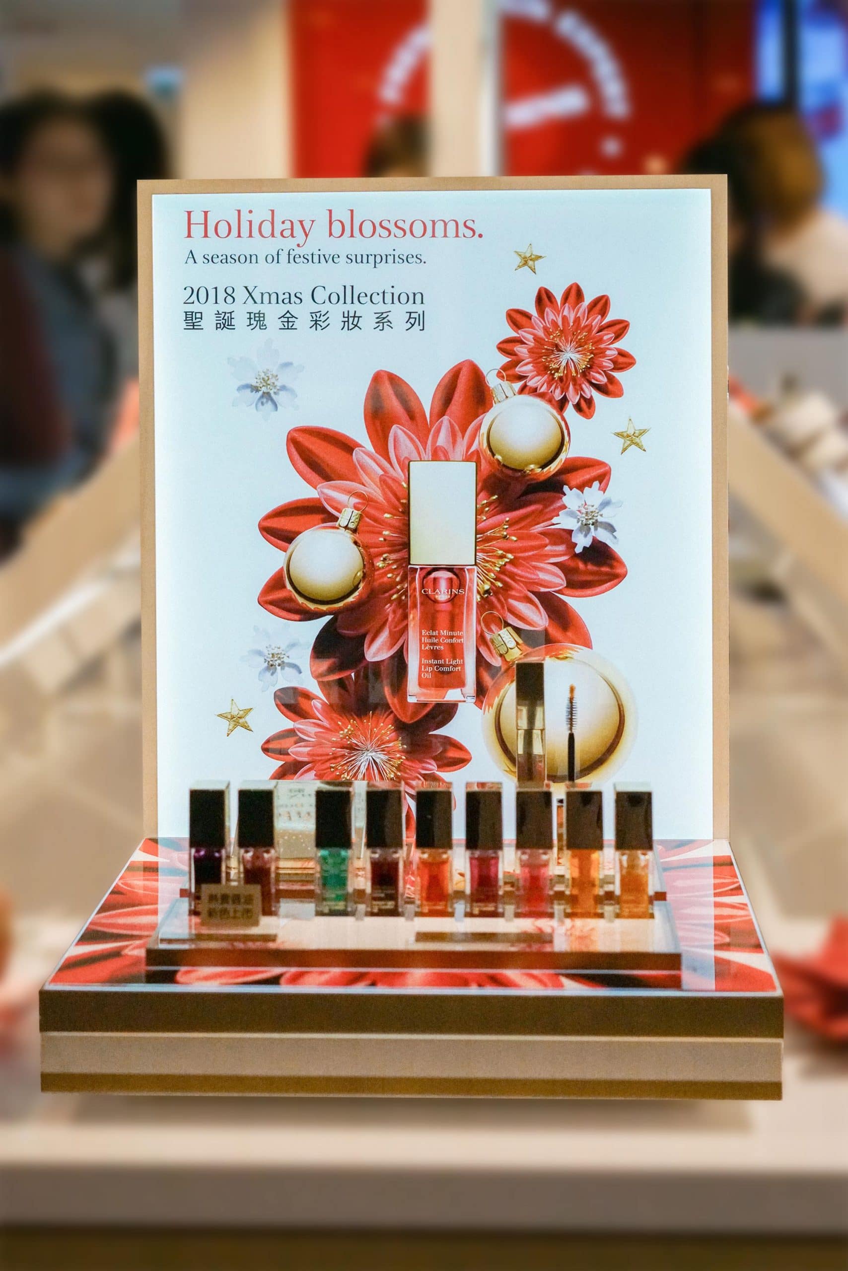 Multi-material cosmetic retail display combining high-gloss body, clear covers and metal details -- manufactured by Samtop Display