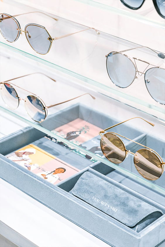 Glasses displayed on glass shelves