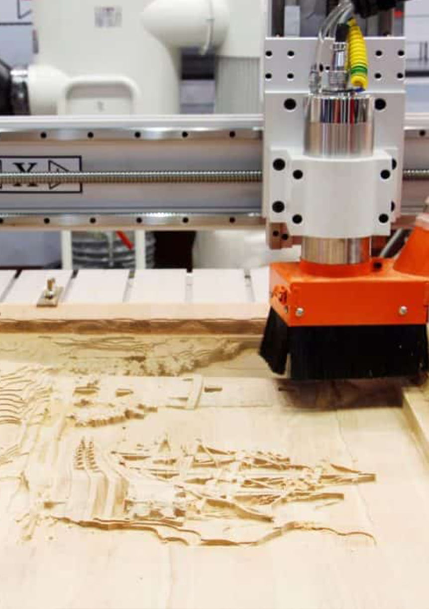 Hand carving on wood display component -- CNC and manual woodworking for retail display bodies