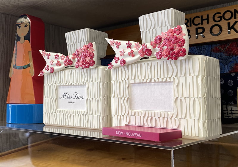 Luxury skincare glorifier display featuring marble, acrylic, and soft lighting