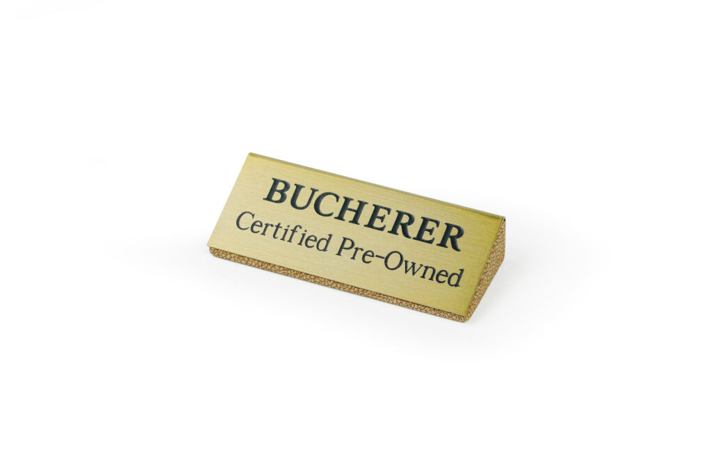 brushed brass logo embedded in riser