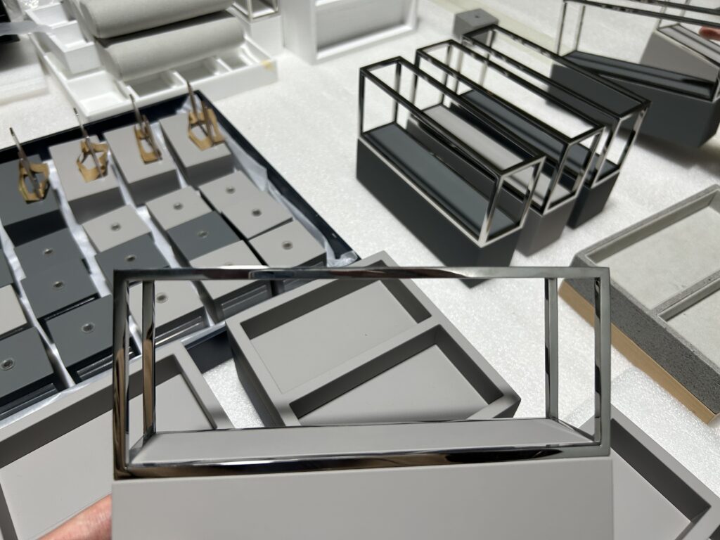 Comparison of textured and glossy surface finishes on retail display fixtures