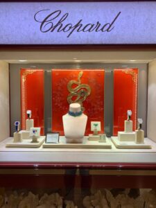 alt="Dior J’adore fragrance glorifier display in luxury retail store"