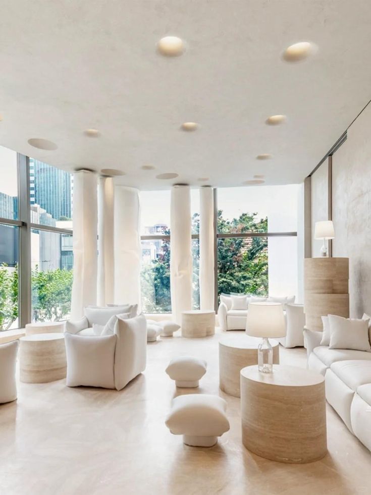 Minimalist luxury lounge featuring natural stone textures and soft modular furnishings for seasonal retail campaigns.