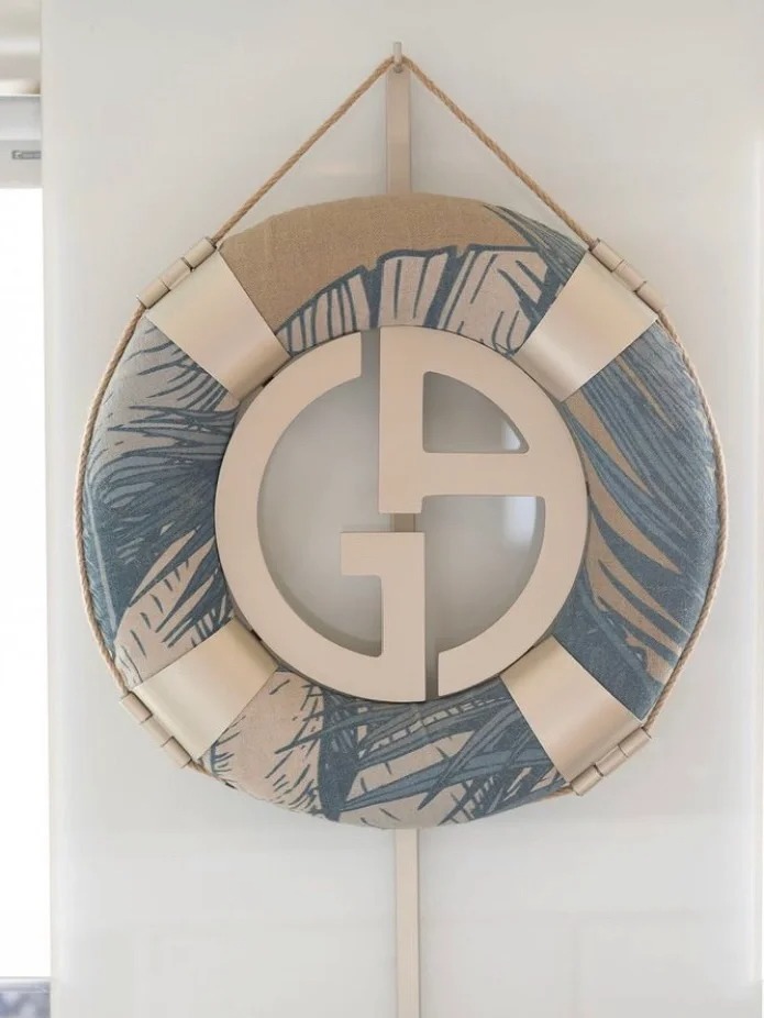 UV-painted paper surfboard with tropical coconut tree props for fashion window”
