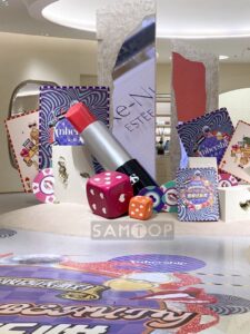 Oversized lipstick sculpture in luxury retail store