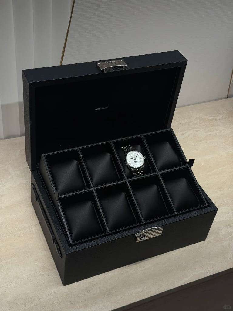 A custom luxury watch box featuring premium textured leather and a clear display window, representing high-end bespoke packaging solutions.