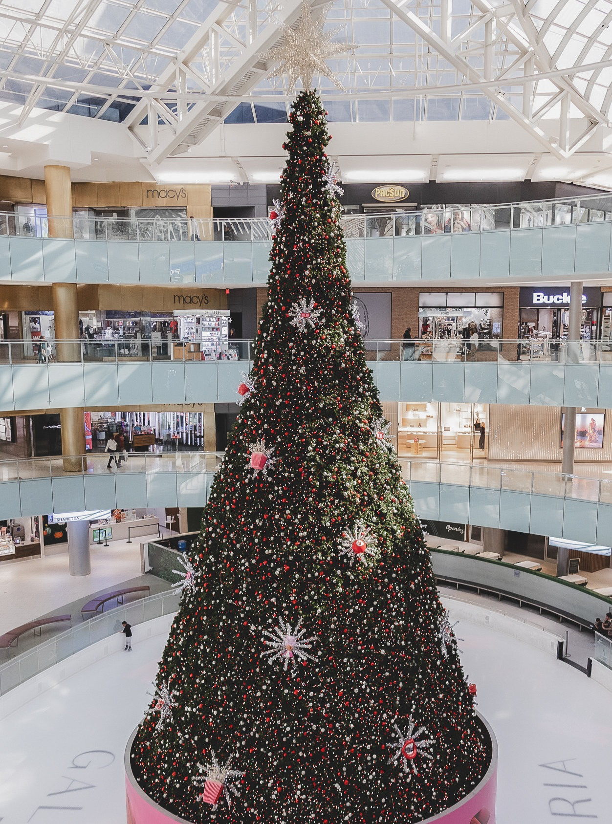 Wide-angle view of the 95ft custom mall Christmas installation at Galleria Dallas, showing the full tree height across multiple shopping floors