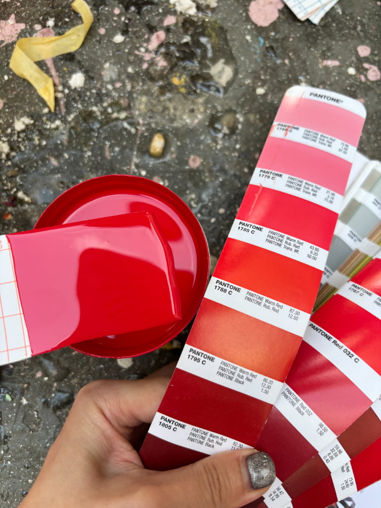Red and pink Pantone color matching process for fiberglass and resin props used in a branded holiday installation.