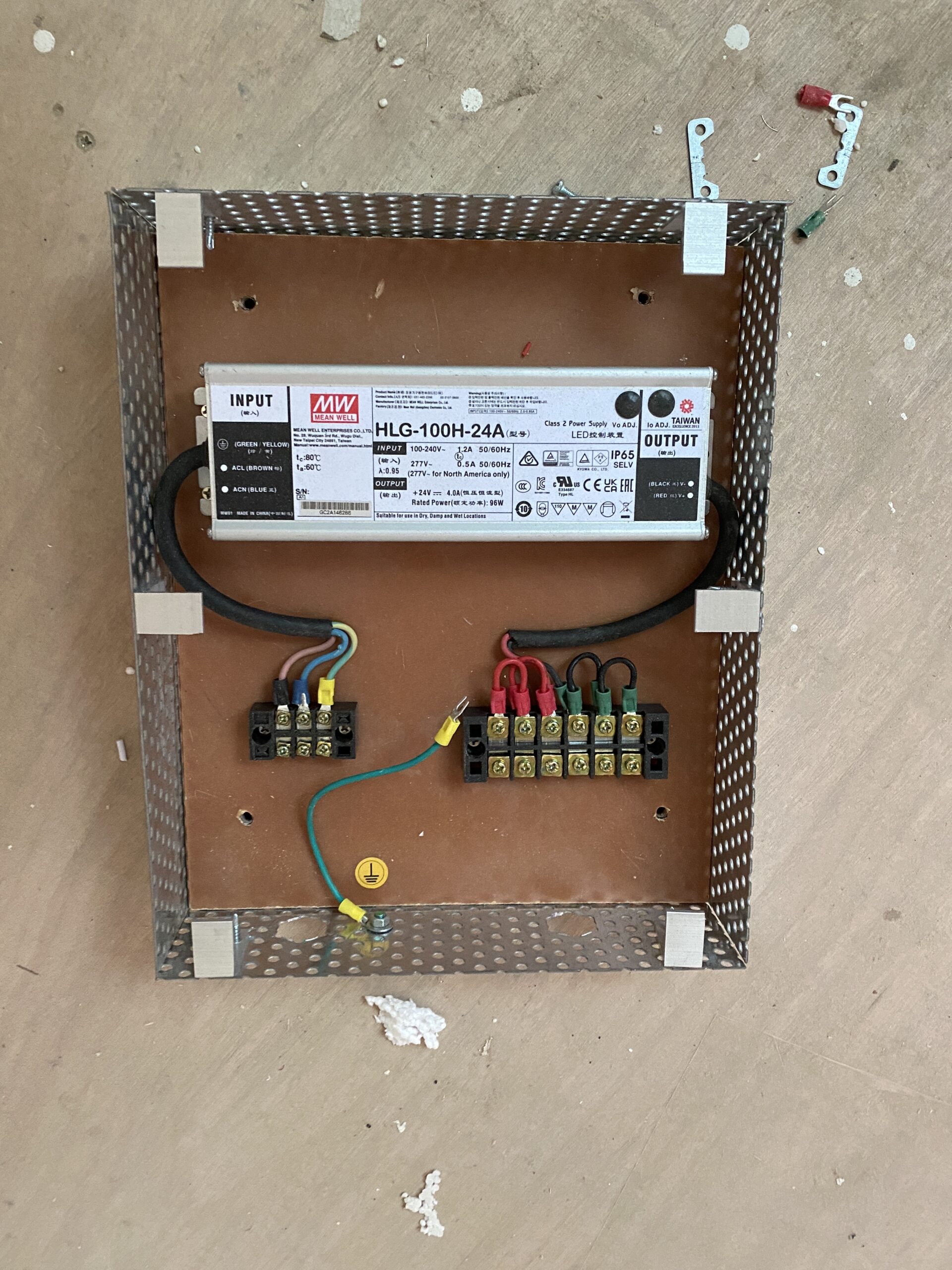 LED power supply mounted inside a ventilated metal driver enclosure.