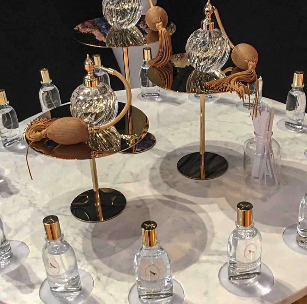 perfume display risers for luxury fragrance counter visual merchandising