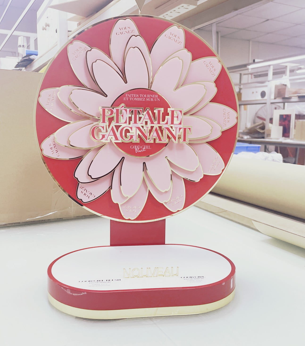Rotating perfume countertop display with acrylic petals
