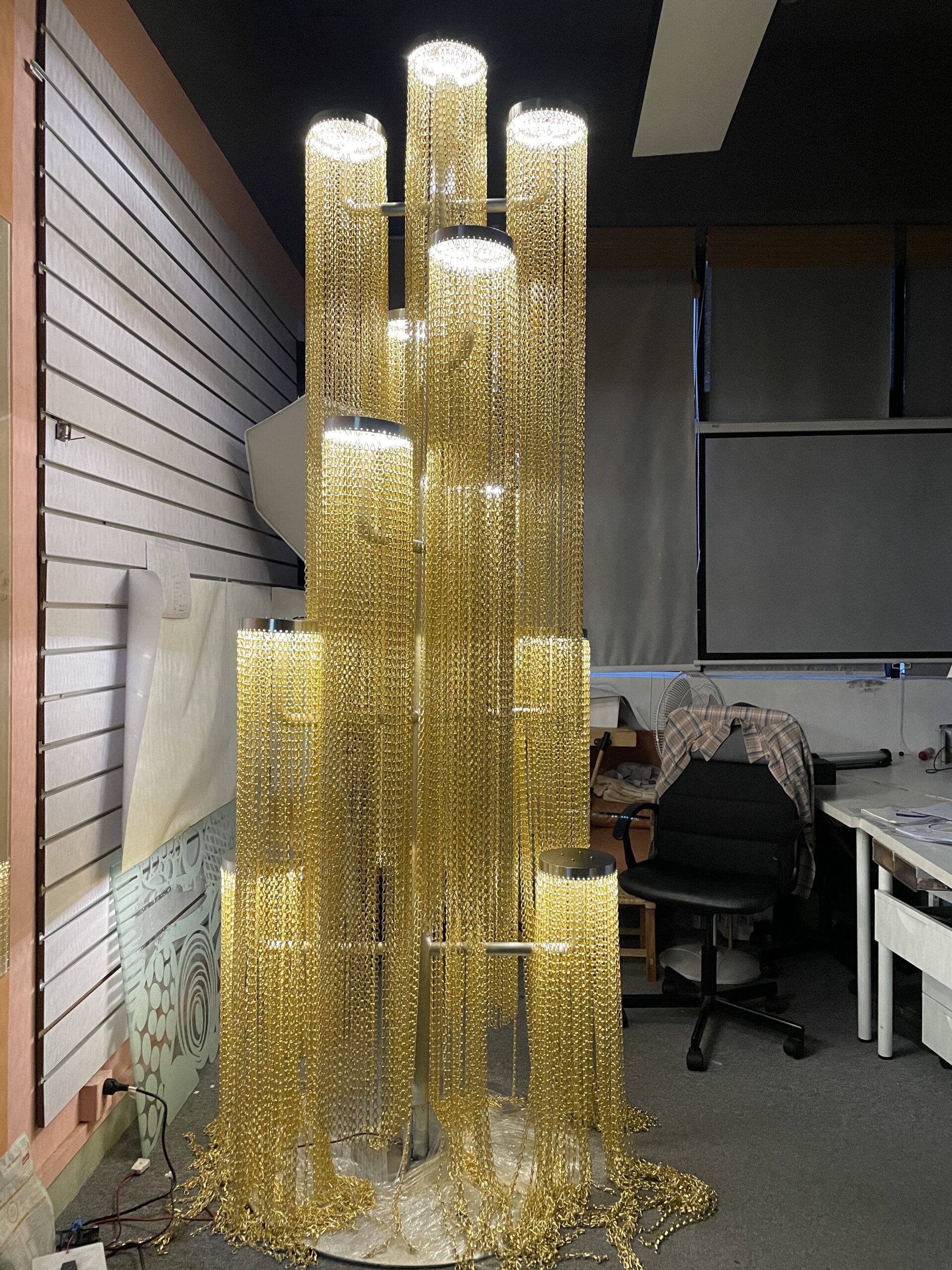 Christmas tree prop assembled in the factory to check LED lighting, decorative chains, structure, and overall silhouette.