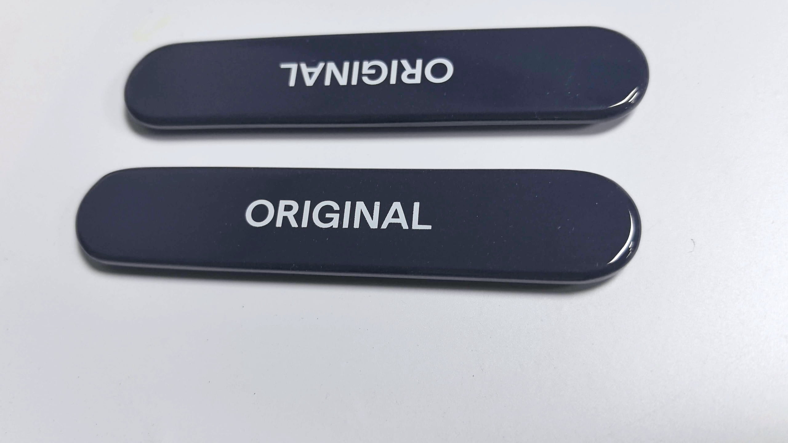 Individual retail display component sample showing product holder or acrylic part -- checking fit and function before full prototype build