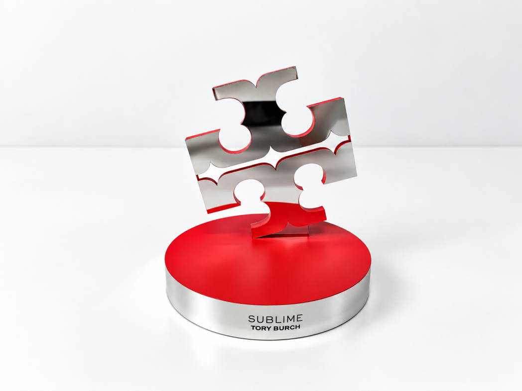 Perfume glorifier display showing product holder with tester bottle -- checking fit, removal angle and display appearance when product is absent